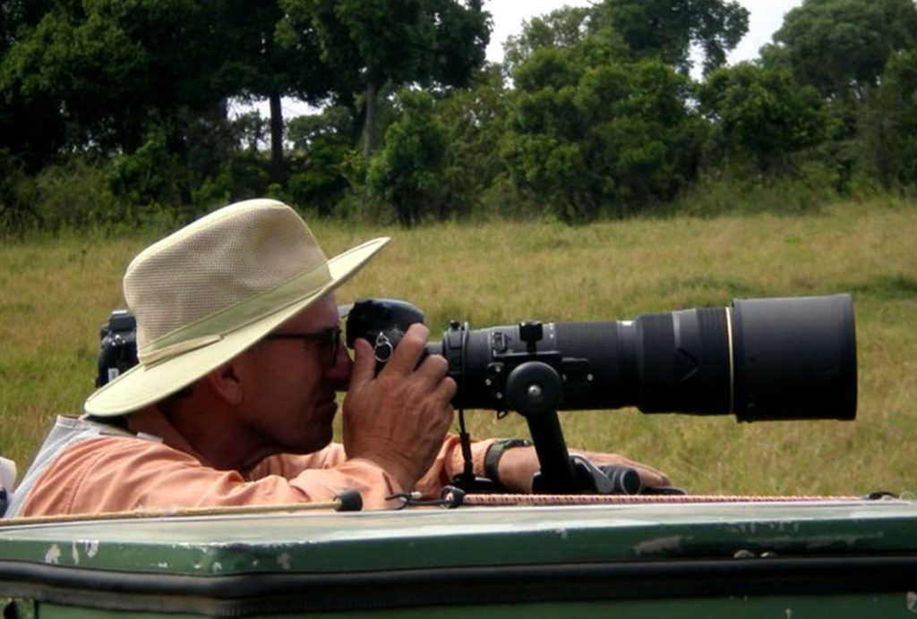Man taking photographs on a Kenyan Safari